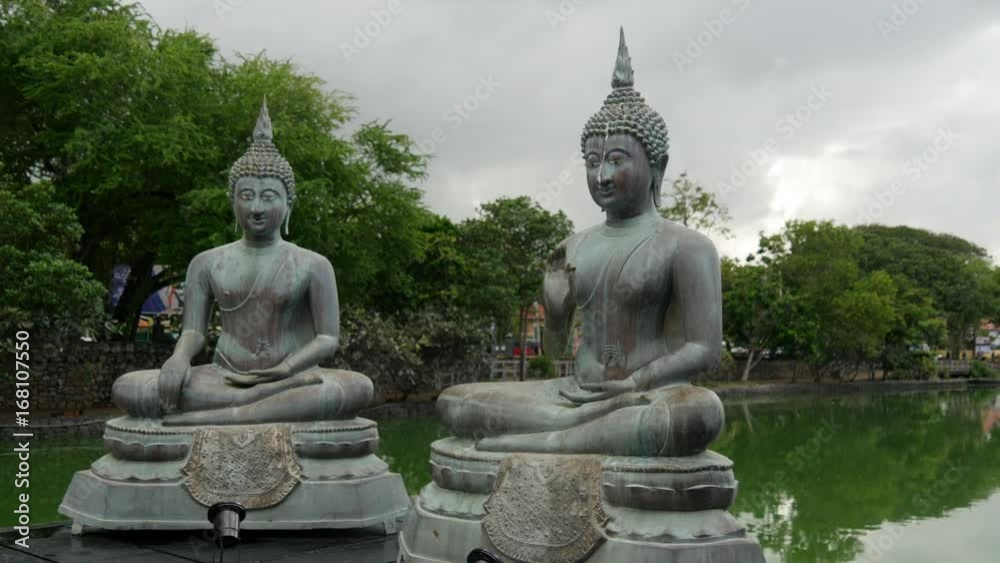Buddhism statues at the Simamalaka shrine, on an island in Beira Lake, Colombo Buddhism statues at the Simamalaka shrine, on an island in Beira Lake, Colombo
