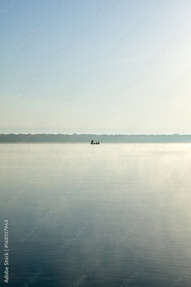 Tranquil scene of boat in calm lake Tranquil scene of boat in calm lake