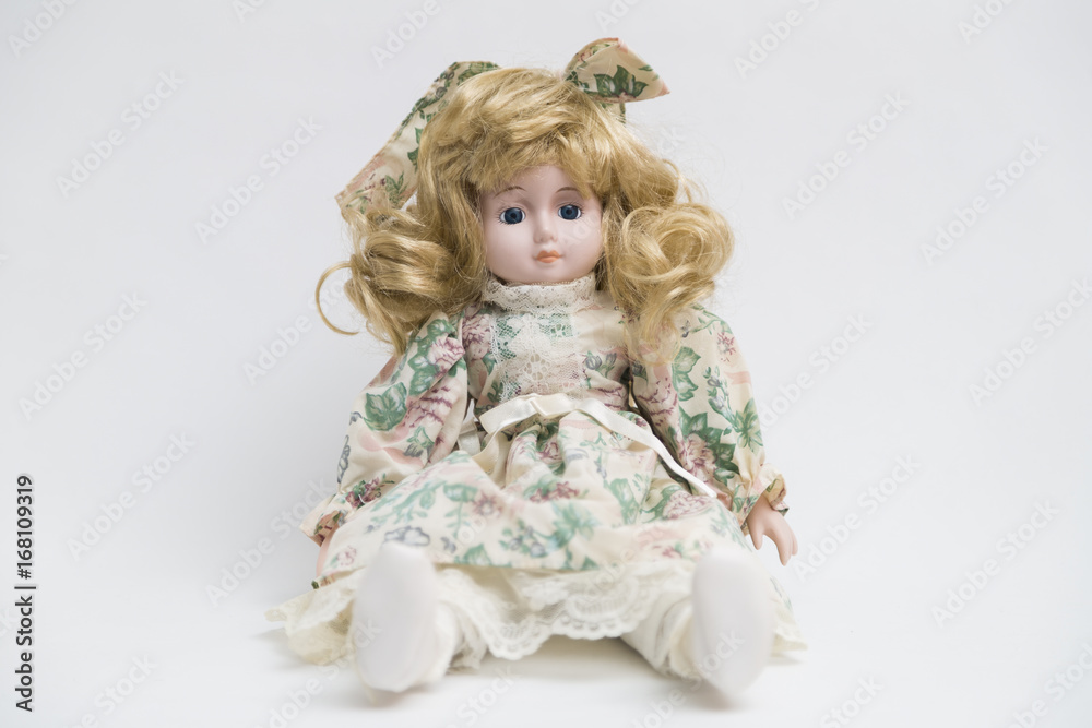 Ceramic porcelain handmade doll with long blond hair and floral dress