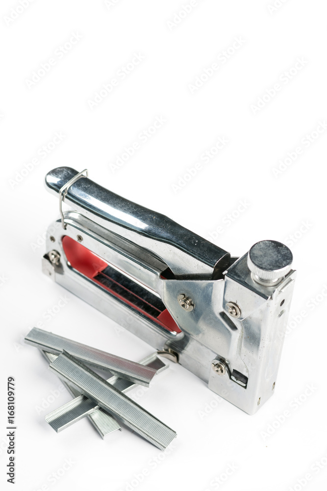 Metal stapler futniture tool with ammunition on the white background Metal stapler futniture tool with ammunition on the white background