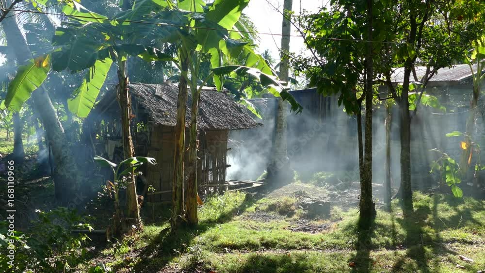 Smoke coming out a house at the countryside in Anda Bohol the Philippines
