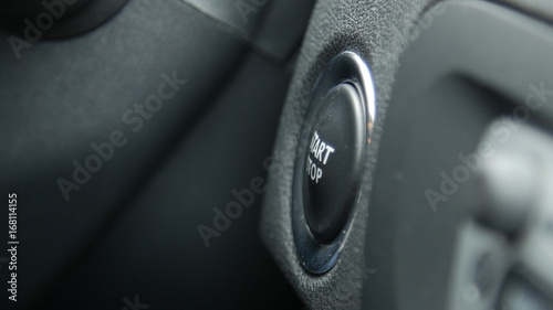 Close up of engine start and stop button of a car.