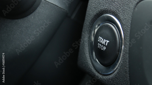 Close up of engine start and stop button of a car.