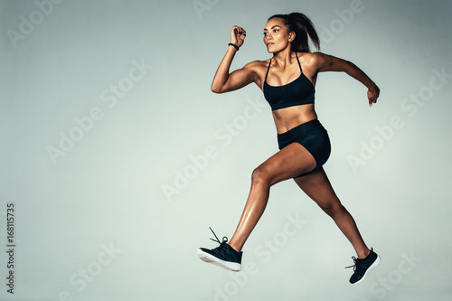 Hispanic female model doing running exercise © Jacob Lund