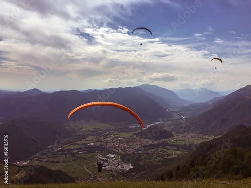 Paragliders flying over Soca Valley, Slovenia
