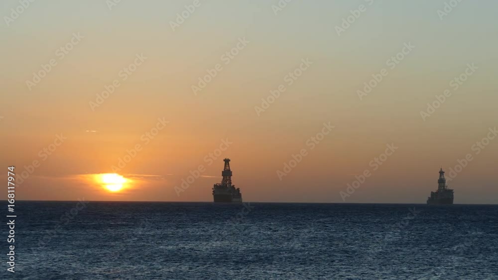 Sunset on Aruba with Oil tankers at the horizon Sunset on Aruba with Oil tankers at the horizon