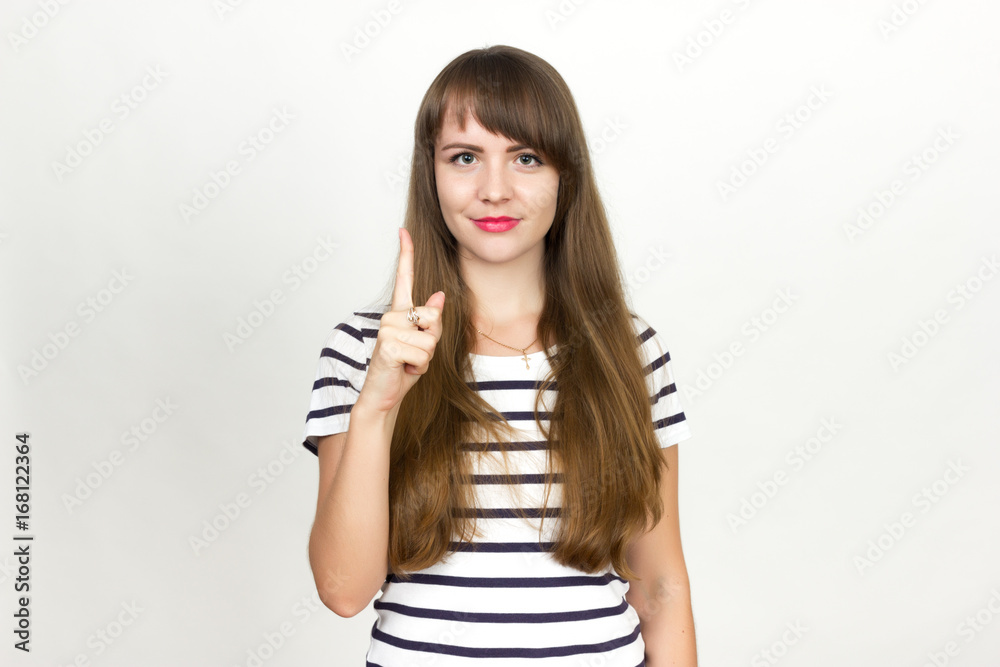 Young happy girl pointing up to product Young happy girl pointing up to product