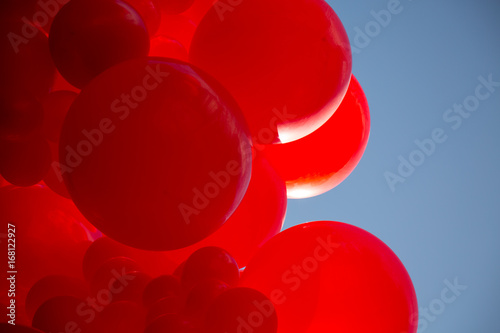 Concept birthday celebration abstract vibrant red ballon bunch 