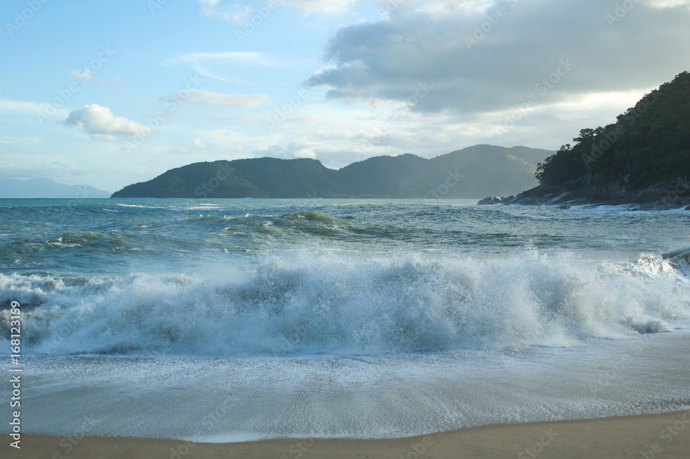 breaking waves at small beach by the end of the day breaking waves at small beach by the end of the day
