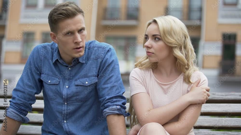 Girlfriend and boyfriend sitting next to each other angry, couple fighting Girlfriend and boyfriend sitting next to each other angry, couple fighting