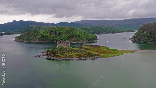 Aerial view of the old ruined Castle in the Highlands of Scotland photo