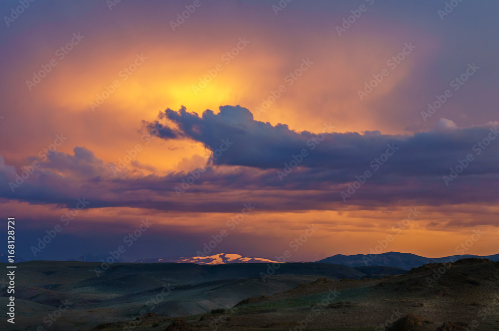 Scenic sunset and sunrise in mountainous region of Altai