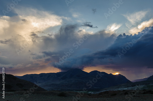 Scenic sunset and sunrise in mountainous region of Altai