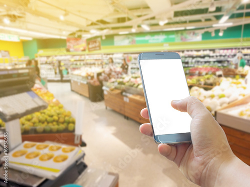 Layout with smart-phone holding in your hand, Screen blank for application,  supermarket shoping