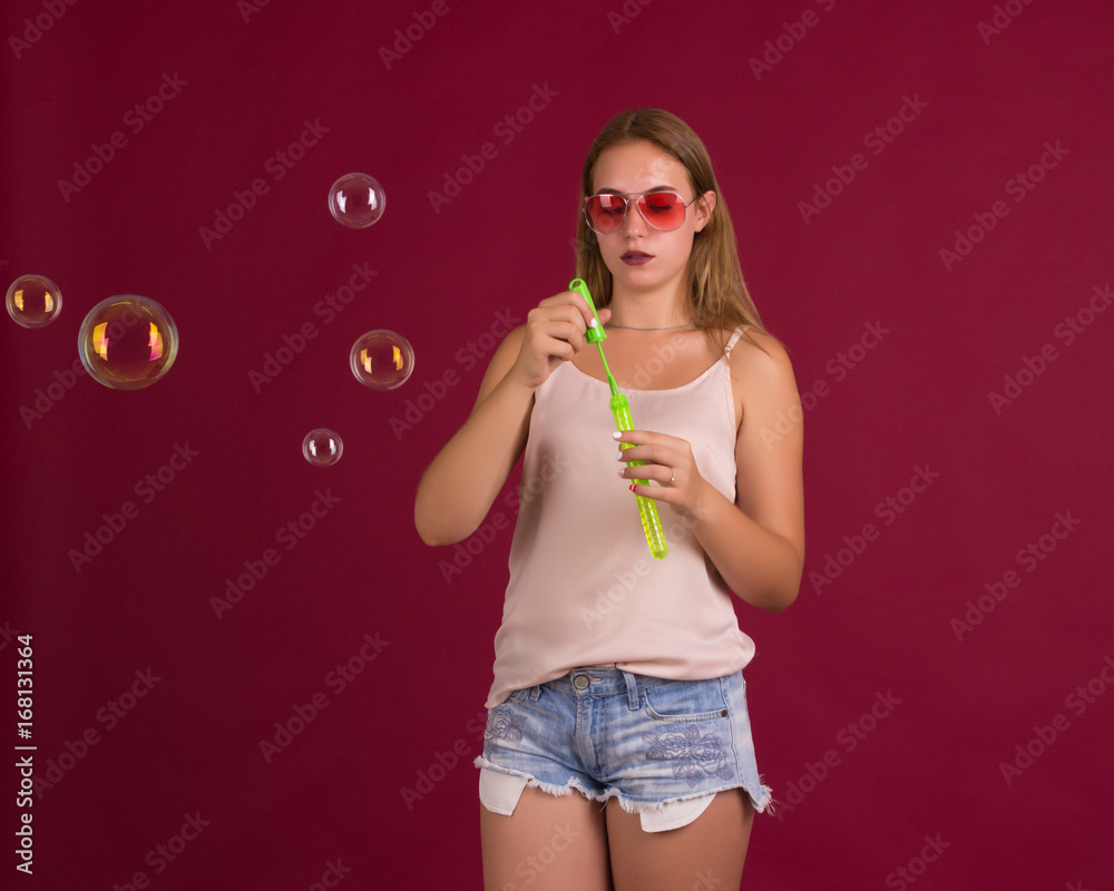 Young cute girl blows bubbles, pretty woman Young cute girl blows bubbles, pretty woman