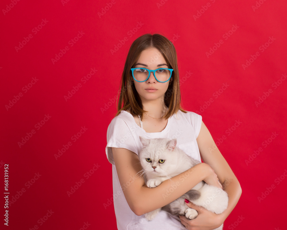 Young cute girl with cat, studio Young cute girl with cat, studio