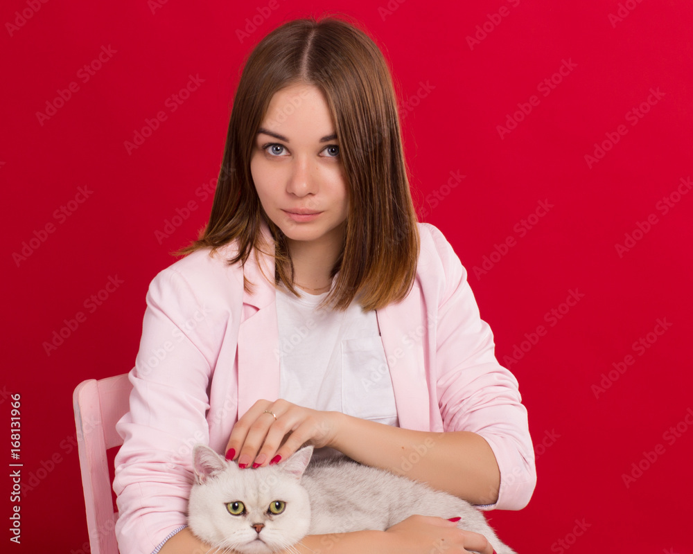 Young cute girl with cat, studio Young cute girl with cat, studio