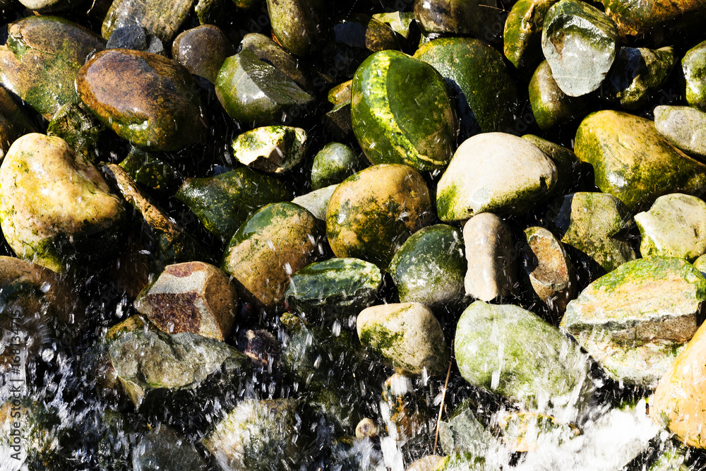 Water Splashing On Moss Covered River Rocks Water Splashing On Moss Covered River Rocks