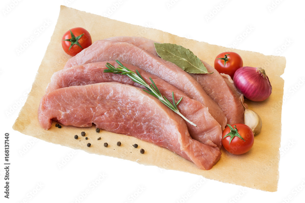 Pieces of fresh pork meat with tomatoes and spices on a sheet of paper isolated on white background. Pieces of fresh pork meat with tomatoes and spices on a sheet of paper isolated on white background.