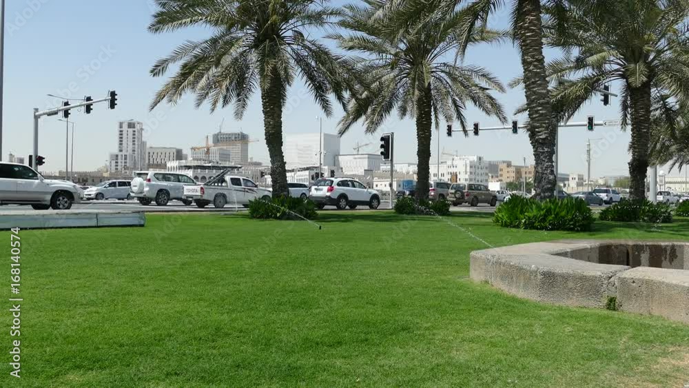 Watering the grass at the Corniche Promenade in Doha Qatar Watering the grass at the Corniche Promenade in Doha Qatar