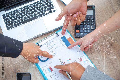 Obraz na plátně Business adviser analyzing financial figures denoting the progress in the work o