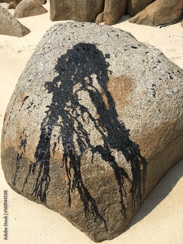 Petroleum gas on a white sand beach in Indonesia photo