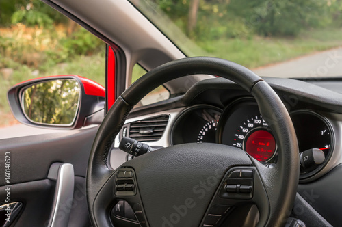 Car interior with steering wheel and dashboard © andriano_cz