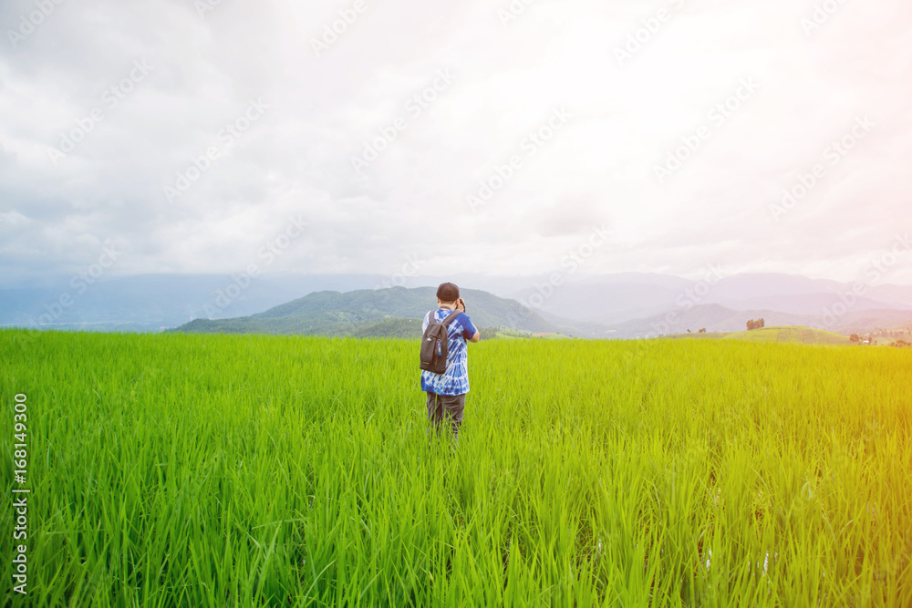 asian woman stand on rice field on morning in Pa Bong Pieng, Chiang Mai, Thailand.