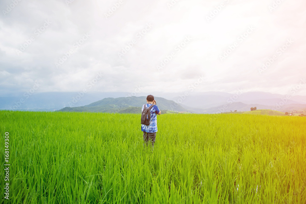 asian woman stand on rice field on morning in Pa Bong Pieng, Chiang Mai, Thailand. asian woman stand on rice field on morning in Pa Bong Pieng, Chiang Mai, Thailand.