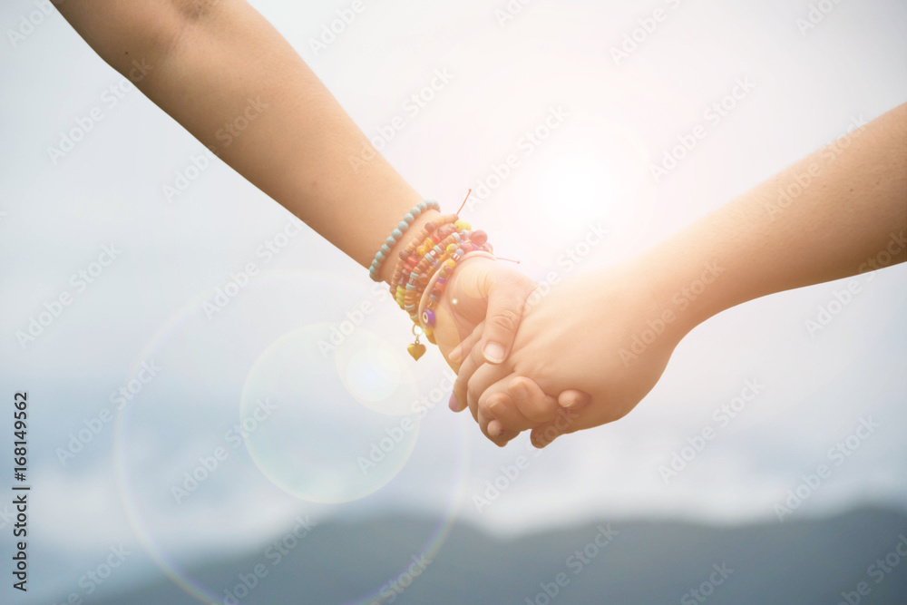 Obraz premium couple love holding hand with nature background.