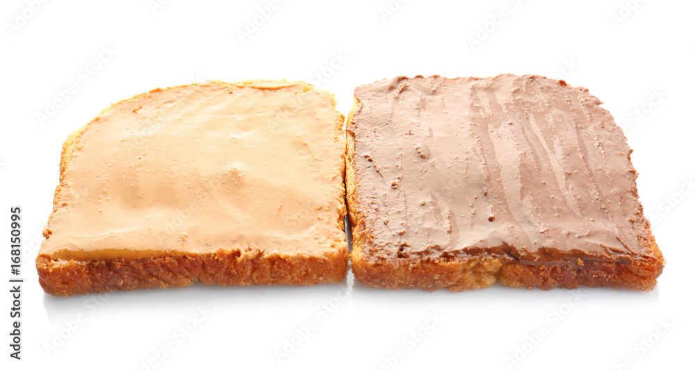 Bread slices with creamy peanut butter on white background Bread slices with creamy peanut butter on white background