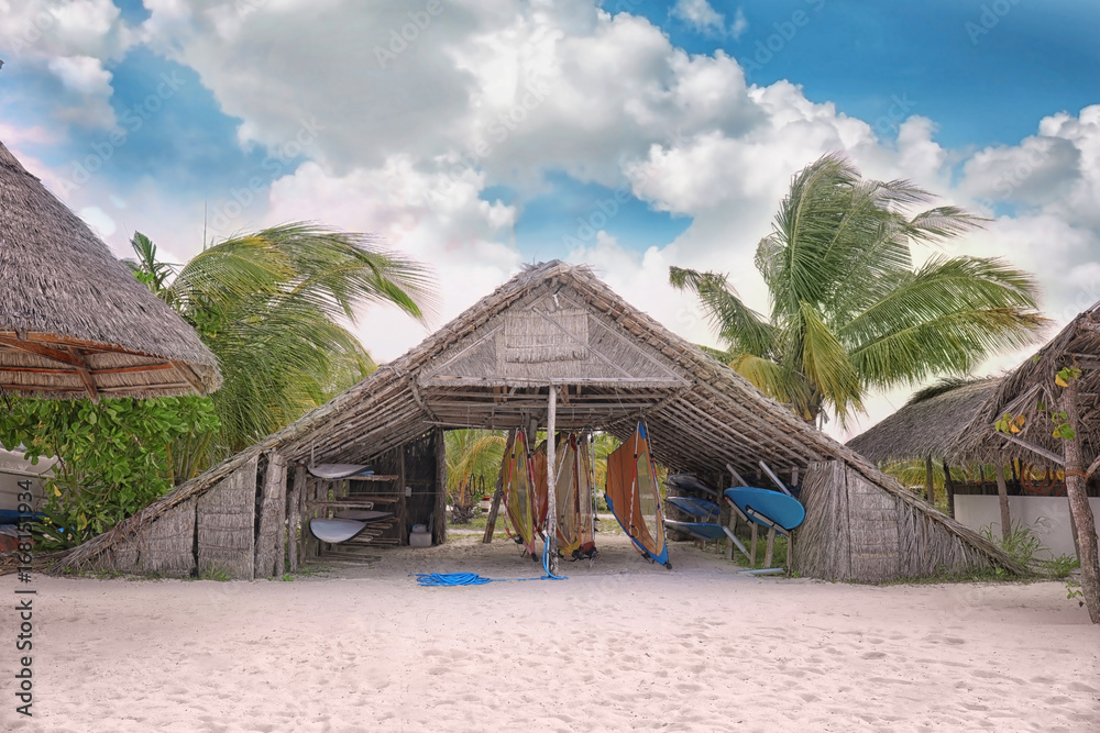 Shelter shed with surf boards on sea beach at tropical resort