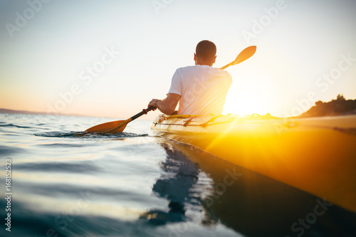 Kayaker paddling the kayak 