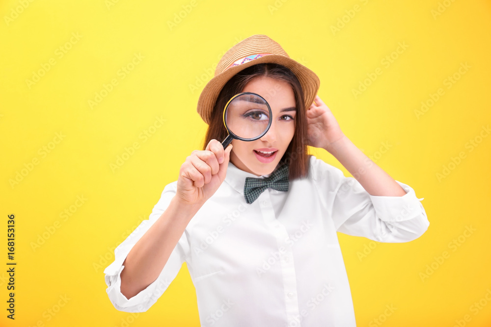 Beautiful young woman with magnifier on color background Beautiful young woman with magnifier on color background