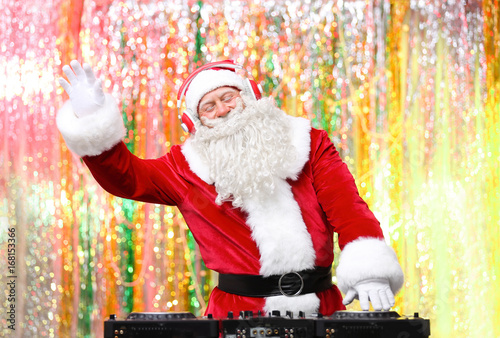 DJ Santa Claus playing musi...