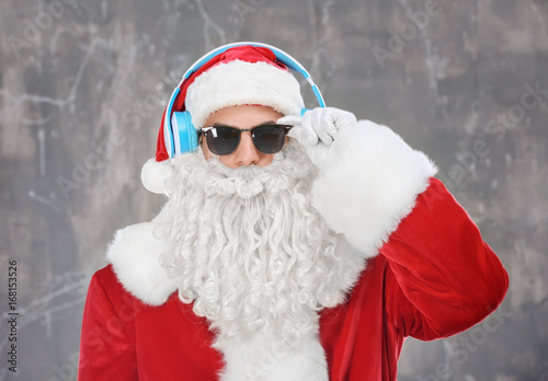 Santa Claus listening to mu...