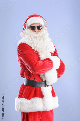 Santa Claus listening to mu...