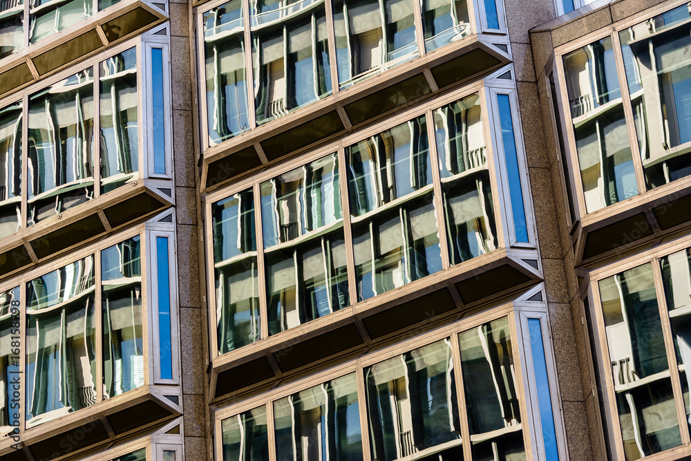 Windows on a Multi-Storey Building Showing Reflections