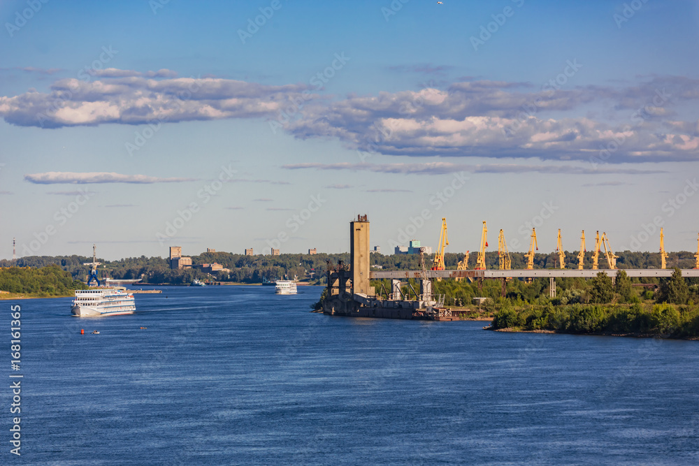Fototapeta premium The Volga river passenger ships and cranes
