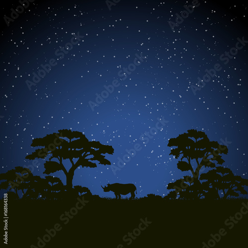 Starry night scene african landscape with silhouette rhino and trees
