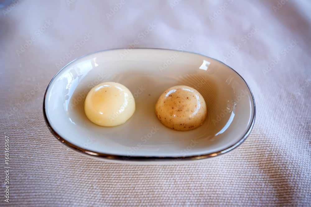 Two round pieces of butter