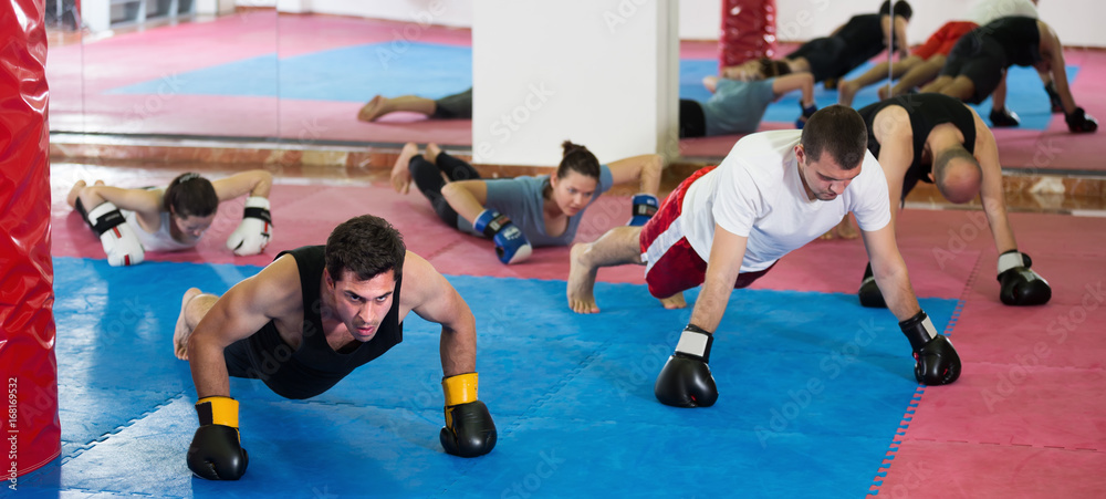 Sports people of different ages training