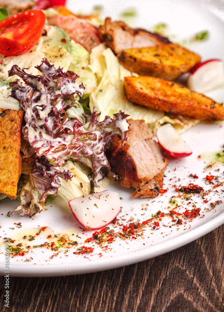 restaurant meals - salad with fresh vegetables grilled veal and baked potatoes restaurant meals - salad with fresh vegetables grilled veal and baked potatoes