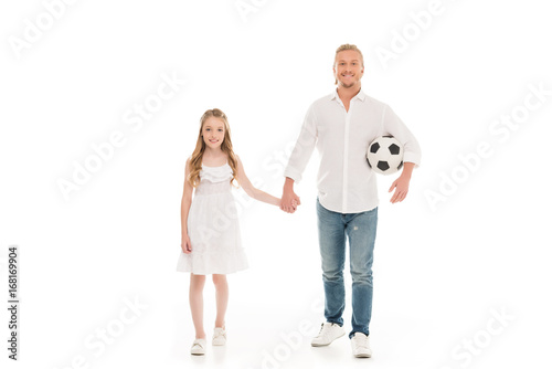 father and daughter with soccer ball