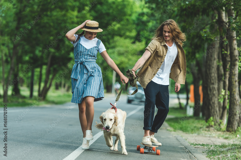couple riding on board with dog couple riding on board with dog