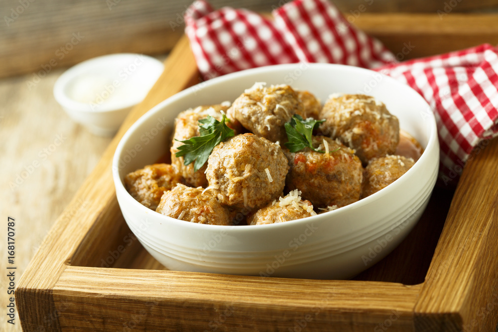 Homemade meatballs with cheese and tomato sauce