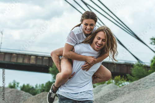 woman piggybacking on boyfriend