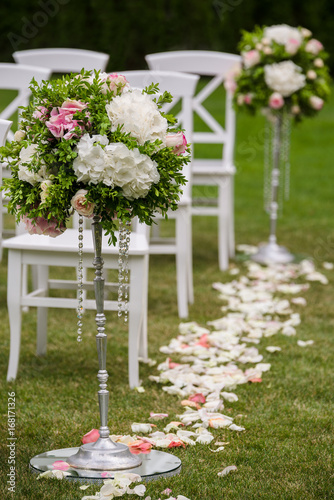 Fototapeta Naklejka Na Ścianę i Meble -  flowers in vases on wedding ceremony