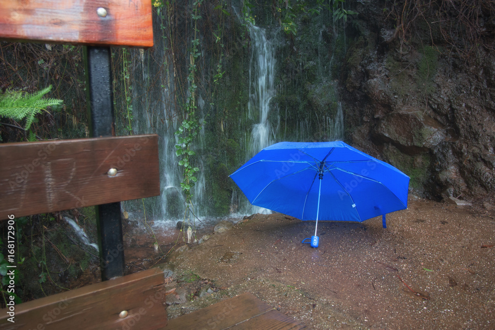 Umbrella near waterfall in Park
