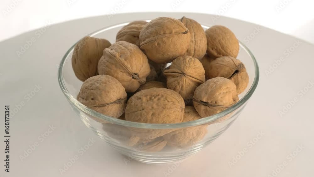 The nut walnut rotates on the turntable. The nut walnut rotates on the turntable.